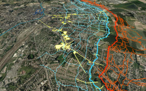 A map of WW1 tunnels overlays an image of modern day Arras. The blue lines show Allied trenches, the red are German trenches, and the yellow are Allied tunnels and quarries.