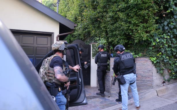 Photos posted by the Los Angeles Police Department show the operation that led to the arrest of singer d4vd – whose legal name is David Burke – on April 16, in the killing of a 14-year-old girl whose decomposed body was found in a car last year. Mandatory Credit: LAPD via CNN Newsource