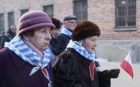 Holocaust survivors attend a wreath laying at the death wall at the memorial site of the former German Nazi death camp Auschwitz.