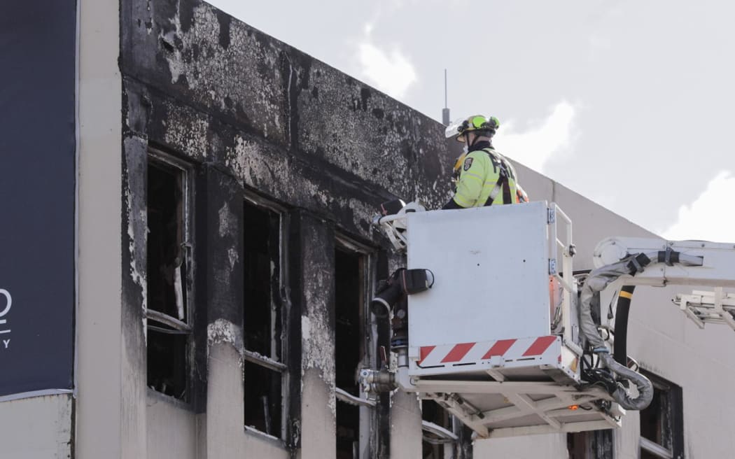 Fire and Emergency use a skylift to assess damage to Loafers Lodge following a fatal fire on 16 May, 2023.