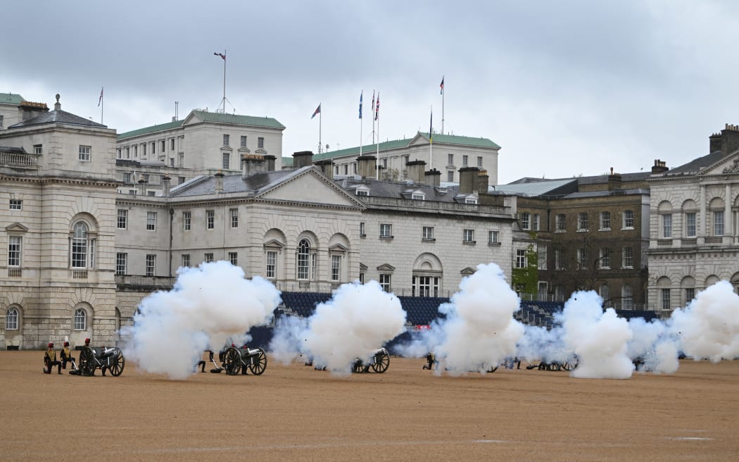 The gun salute ceremony marking the moment King Charles III is crowned takes place at Horse Guards during the Coronation of King Charles III and Queen Camilla on May 6, 2023 in London. - The set-piece coronation is the first in Britain in 70 years, and only the second in history to be televised. Charles will be the 40th reigning monarch to be crowned at the central London church since King William I in 1066. Outside the UK, he is also king of 14 other Commonwealth countries, including Australia, Canada and New Zealand. Camilla, his second wife, was crowned alongside him and will now be known as Queen Camilla. (Photo by Charles McQuillan / POOL / AFP)