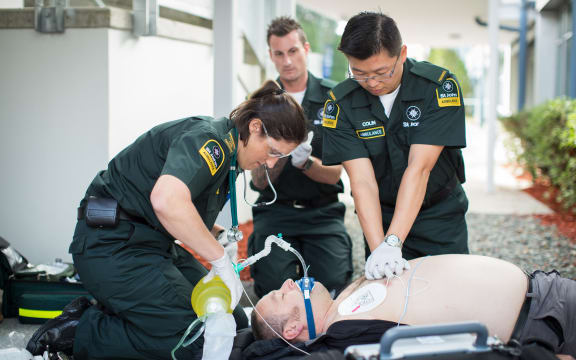 St John Ambulance paramedics performing CPR