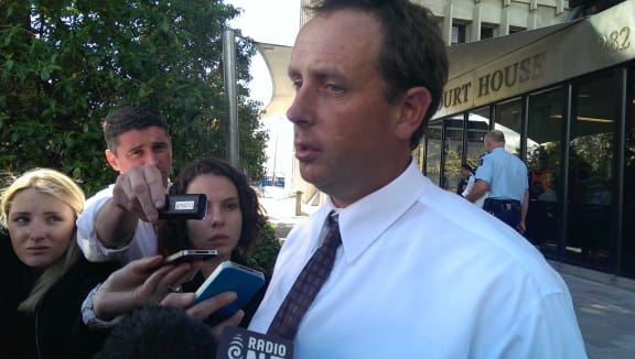 Andy Earl speaks to reporters outside court on Tuesday.