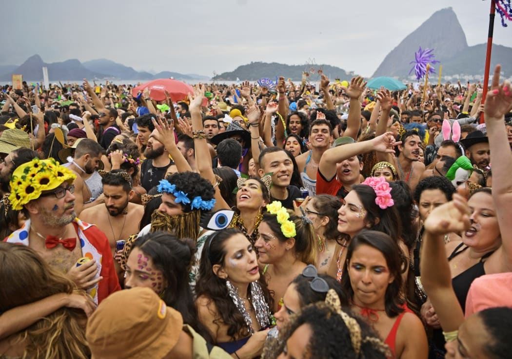 Revellers cheer during the Amigos da Onca street party in Rio de Janeiro, Brazil.