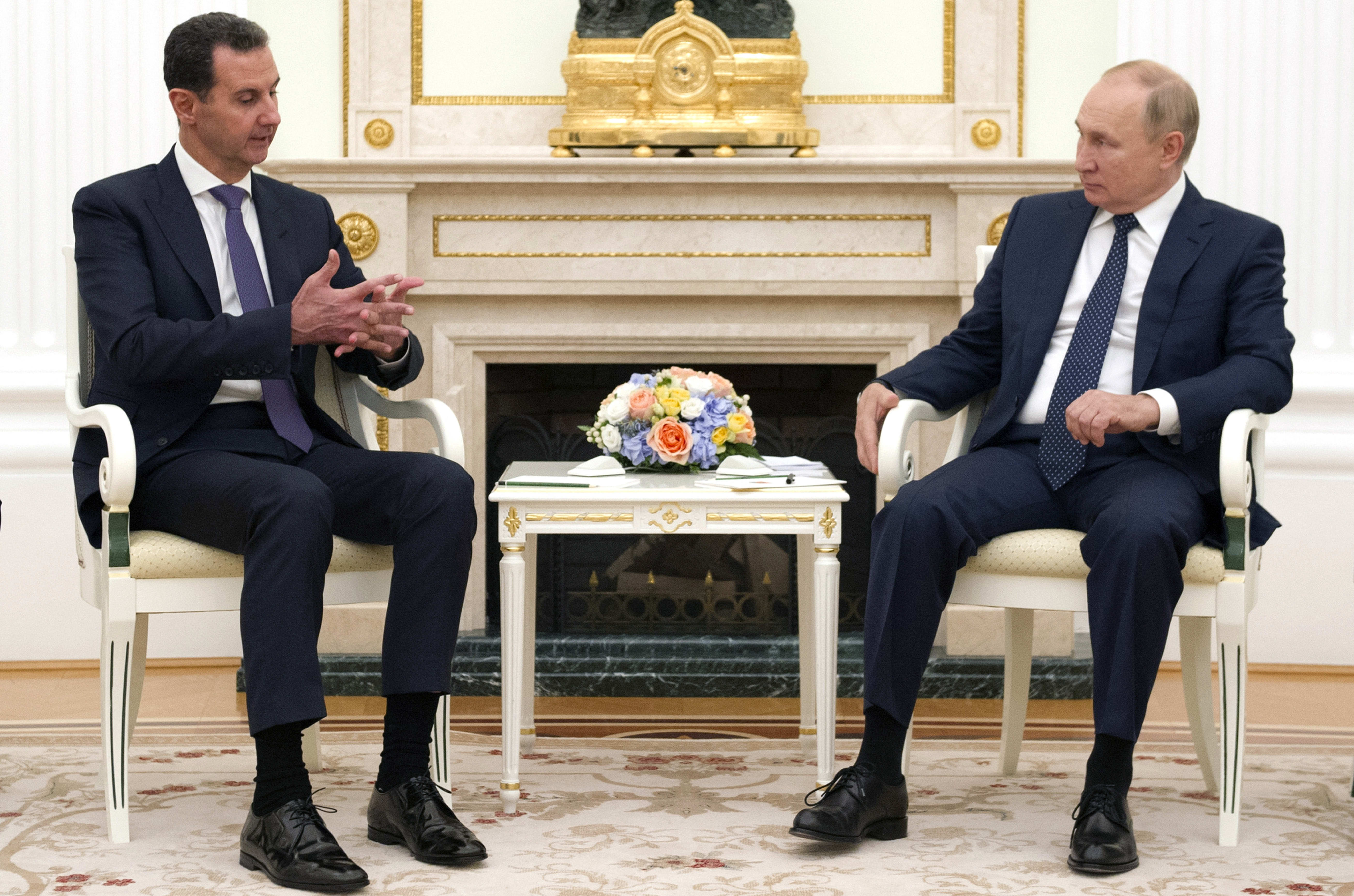 Syrian President Bashar al-Assad, left, talks to Russian President Vladimir Putin during a meeting in Moscow, Russia.