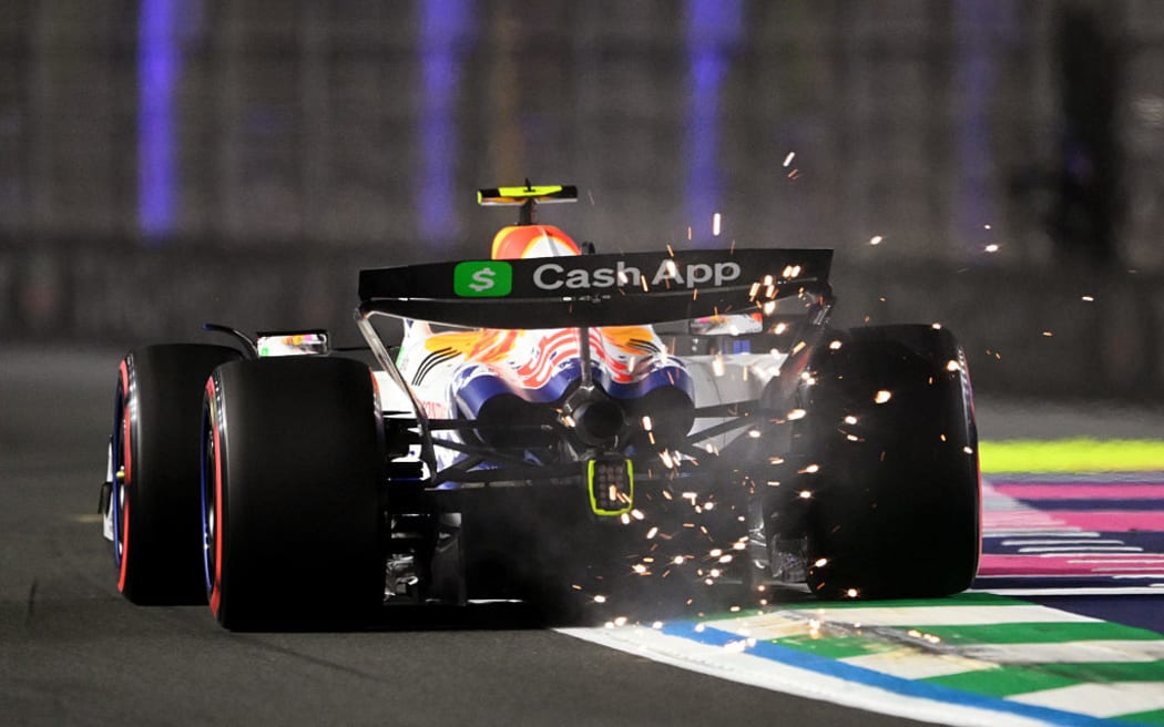 Sparks fly behind Liam Lawson at the F1 Grand Prix of Saudi Arabia at Jeddah Corniche Circuit in Jeddah, Saudi Arabia.