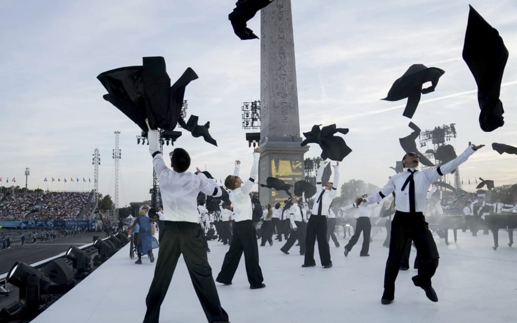 Artists perform at the Place de la Concorde during the Paris 2024 Paralympic Games Opening Ceremony in Paris on August 28, 2024. (Photo by Thibault Camus / POOL / AFP)