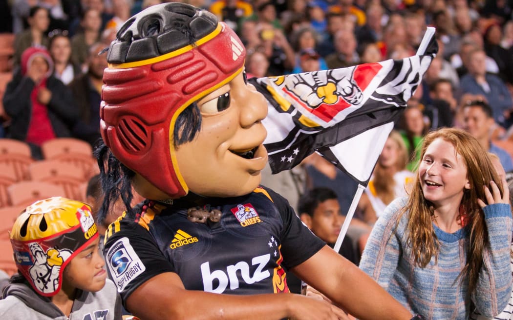 Chief mascot with fans.