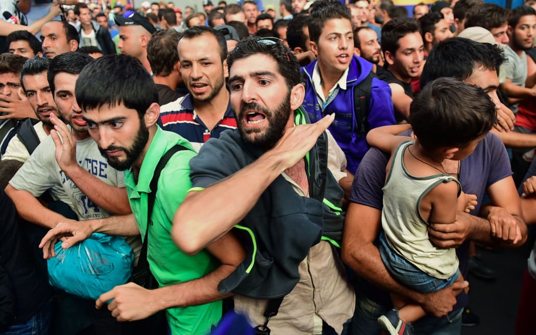 Migrants protest at the Eastern (Keleti) railway station of Budapest on September 1, 2015, after the railway station has been evacuated by local police.