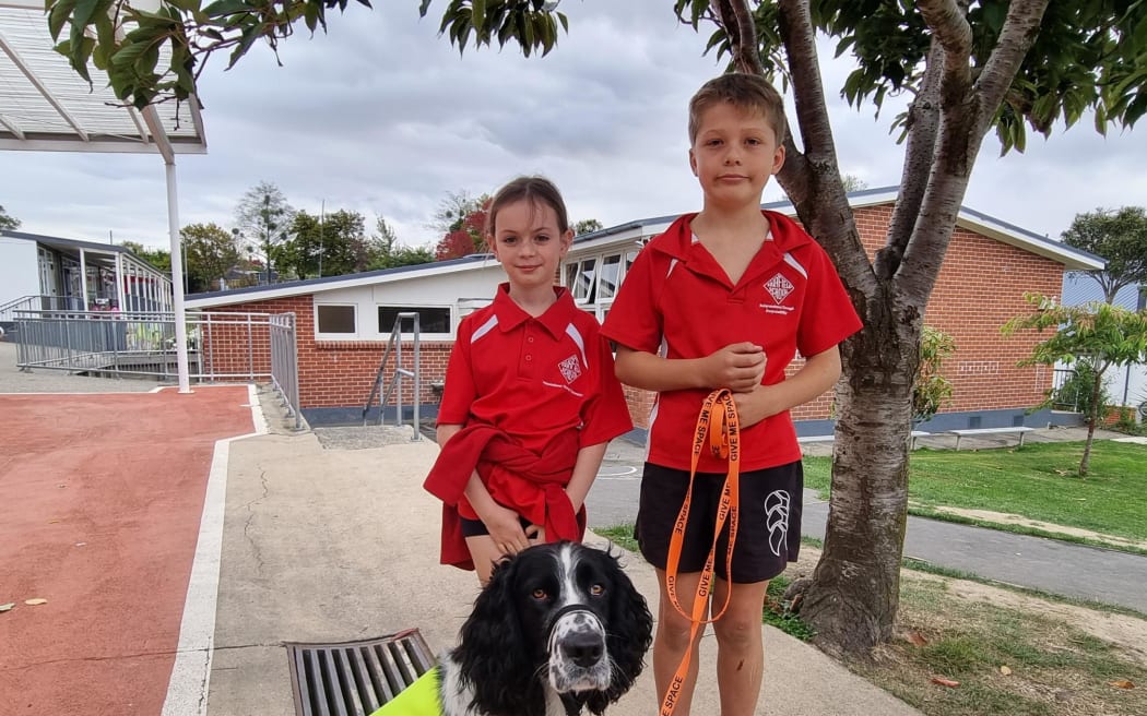 Evie and Quinn, both 10, and Daniel the Spaniel at Fairfield School