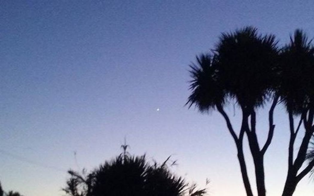 Tricia Lewis took this picture of the balloon light up as the sun set.