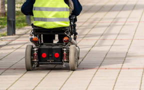 A person on a mobility scooter.