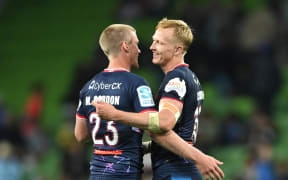 Melbourne Rebels players Carter Gordon and Mason Gordon celebrate. 2024