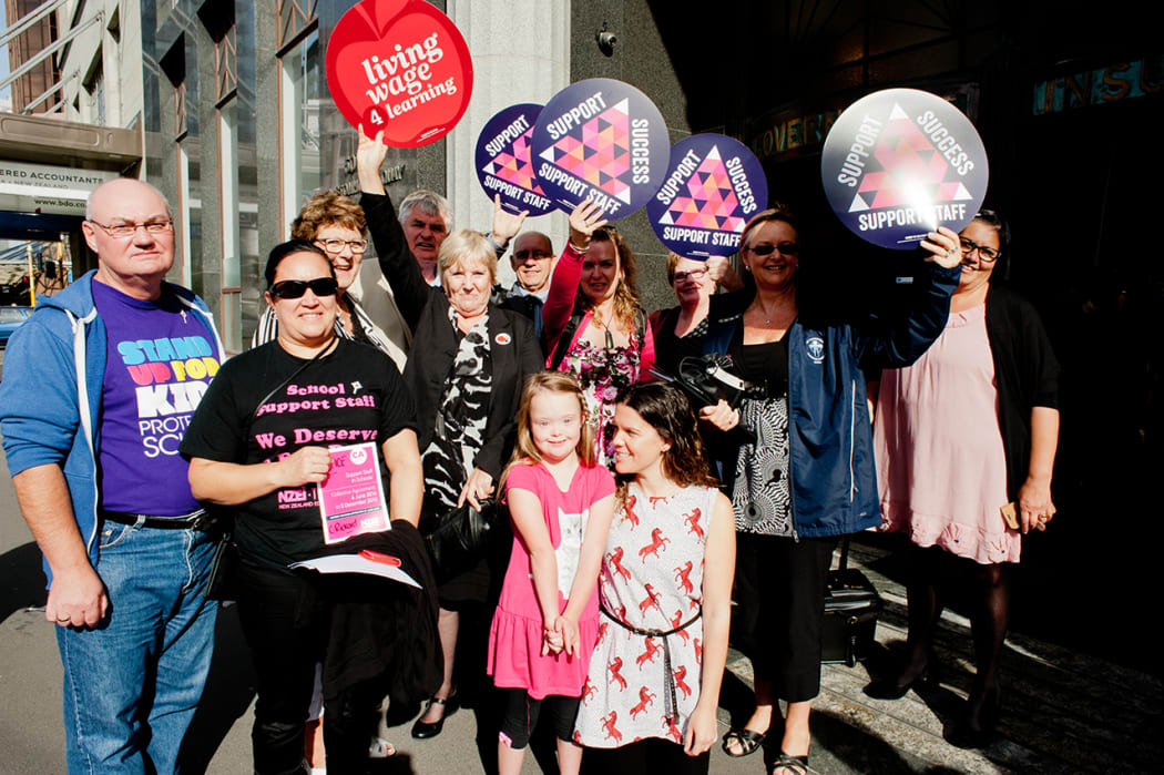 Campaigners backing school support staff gather outside the Employment Relations Authority hearing in Wellington on 7 April.