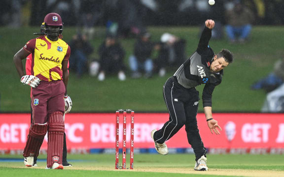 Hamish Bennett bowls in the rain during the New Zealand Black Caps v West Indies match.