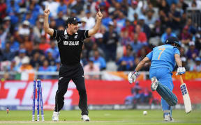 Colin de Grandhomme celebrates the run out of MS Dhoni after a direct hit by Martin Guptill.