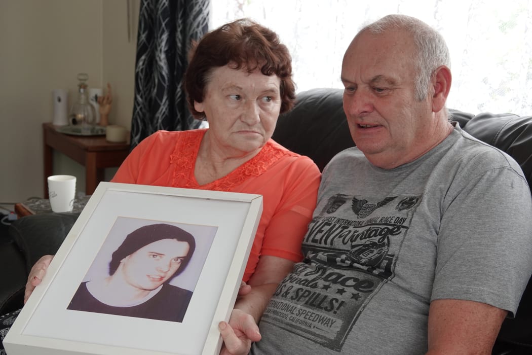 Evelyn and Greg Pike hold a photo of their son Nicholas, who was killed on March 18, 2002.