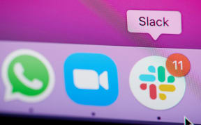 New york, USA - February 25, 2021: Slack app for work message  on laptop screen close up view