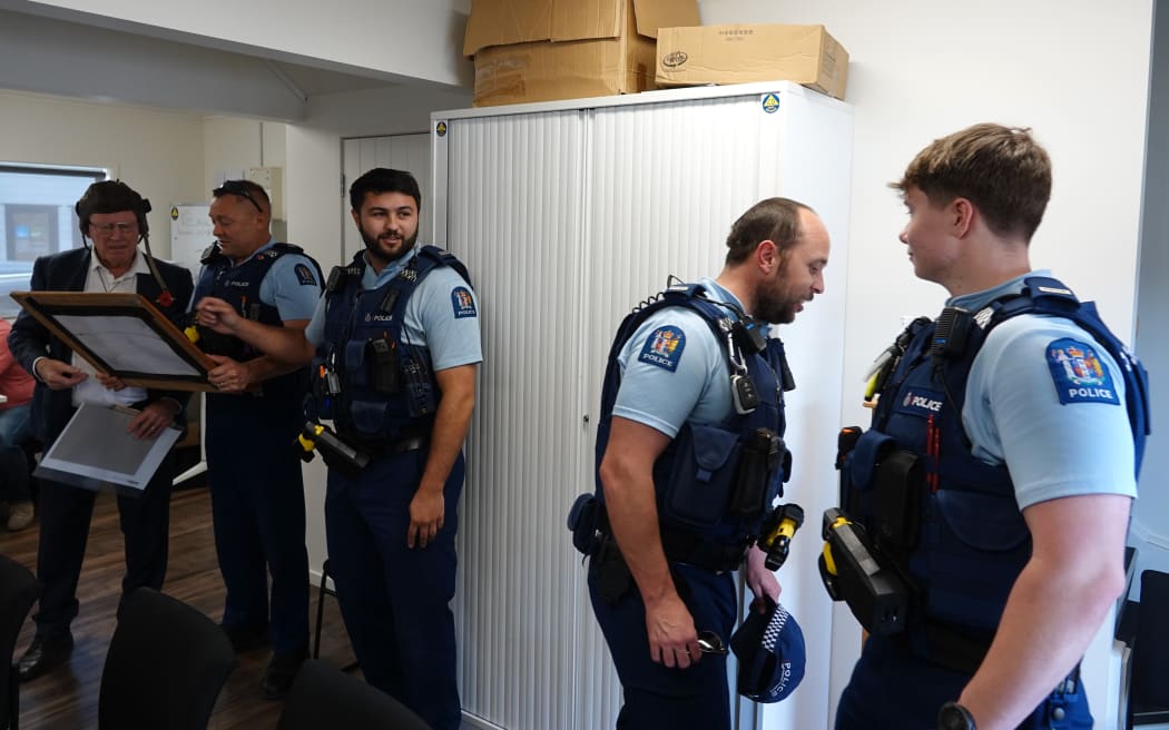Four police officers, and three security guards, kept an eye on the meeting.