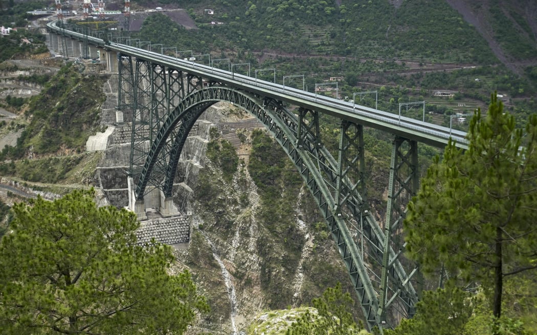 A general view of Chenab bridge, the world's highest rail arch bridge in Reasi, Jammu and Kashmir on July 6, 2024. (Photo by TAUSEEF MUSTAFA / AFP)