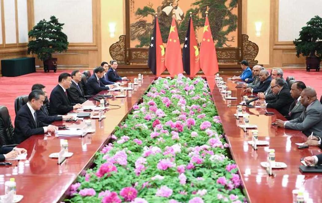 Chinese President Xi Jinping and officials meet with Papua New Guinea's Prime Minister Peter O'Neill and ministerial colleagues in Beijing, April 25, 2019.