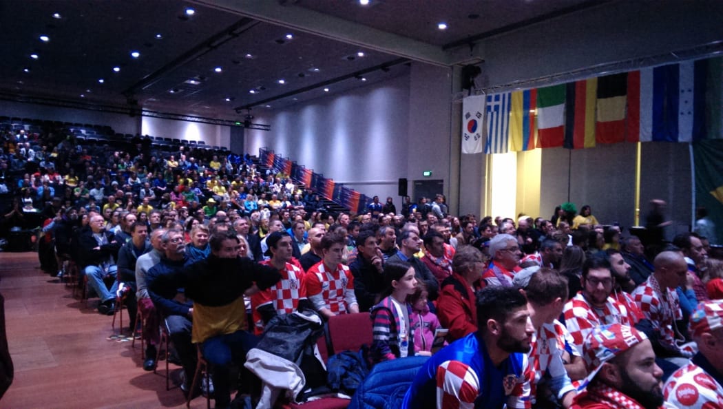 World Cup fans at Shed 6 on the Wellington waterfront watch the opening match.