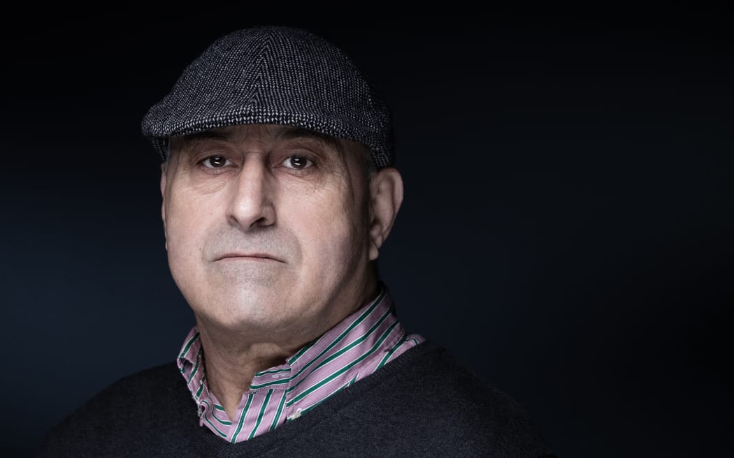 Yunice Abbas, one of five men who robbed US media personality Kim Kardashian at her hotel in Paris in 2016, poses during a photo session for the release of his book in Paris on January 28, 2021. After 22 months behind bars for the Kardashian heist, a judge released him on health grounds, and Abbas now hopes a jury will be lenient after he underwent heart surgery.