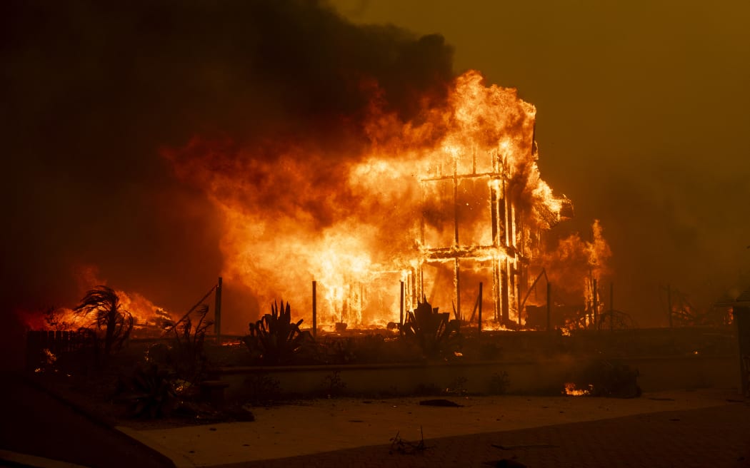 A house is engulfed in the flames of the Mountain Fire as the wildfire scorches acres in Camarillo Heights, Camarillo, California, on November 6, 2024. - A wildfire fanned by powerful winds was burning out of control near Los Angeles on November 6, with scores of residents ordered to evacuate and some taken to hospital.
Fierce gusts up to 80 miles (130 kilometers) an hour were pushing smoke sideways and fueling flames that were tearing through farmland. (Photo by ETIENNE LAURENT / AFP)