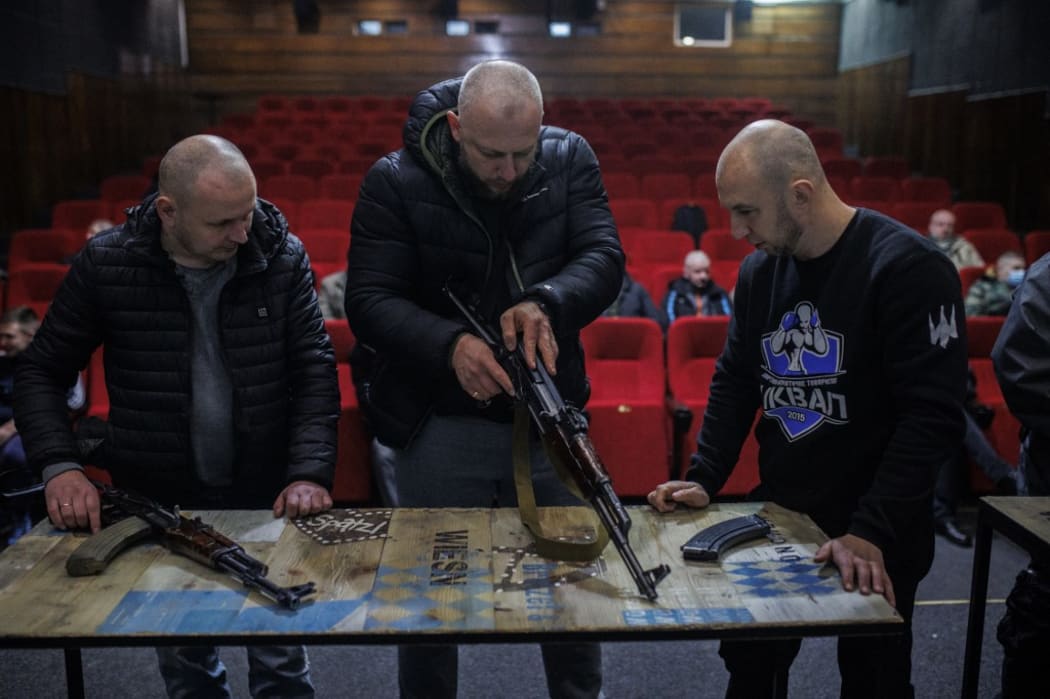 Civilians learn to use AK47 rifles in a cinema at the Lviv Film Center on 5 March 2022 in Lviv, Ukraine.