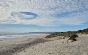 A cloud that looks like a UFO seen from Forestry Beach, Te Arai.