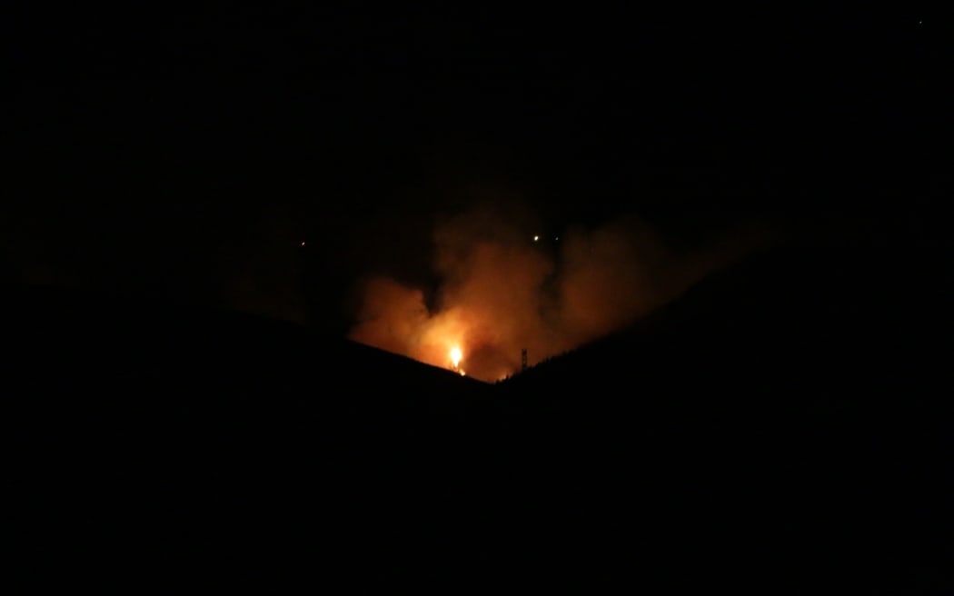 An early morning view of the Port Hills fire from the road block on Worsleys Road, 15 February, 2024.