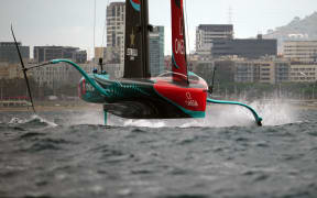 Defender Emirates Team New Zealand competes on day 1 of the Louis Vuitton 37th America's Cup Match against Britain's Ineos Britannia (not seen) off the coast of Barcelona on October 12, 2024. (Photo by Manaure Quintero / AFP)