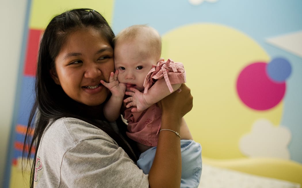 A file photo of Thai surrogate mother Pattaramon Chanbua holding her baby Gammy, born with Down Syndrome.