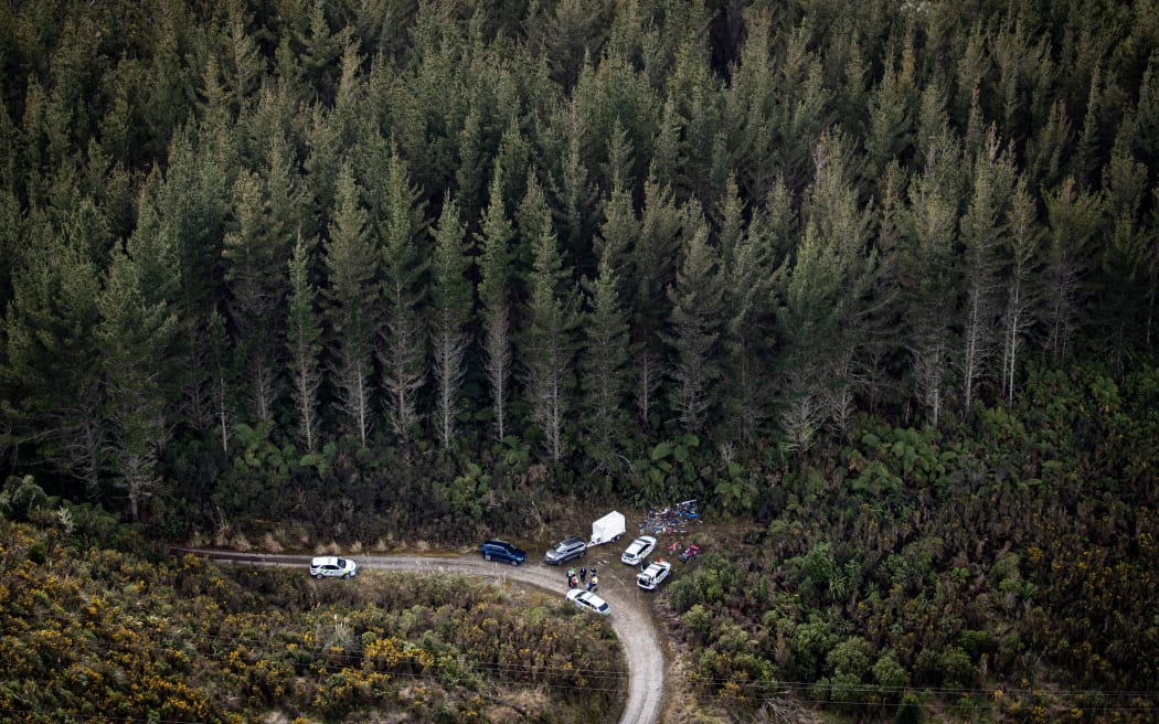 WAITOMO, NEW ZEALAND - SEPTEMBER 11: Police gather items at a site off Te Anga Rd, near Waitomo, where Tom Phillips and his children had been hiding for the last four years. Tom Phillips was killed after getting into an armed shootout with Police. 11 September 2025. (Photo by Dean Purcell/New Zealand Herald via Getty Images)