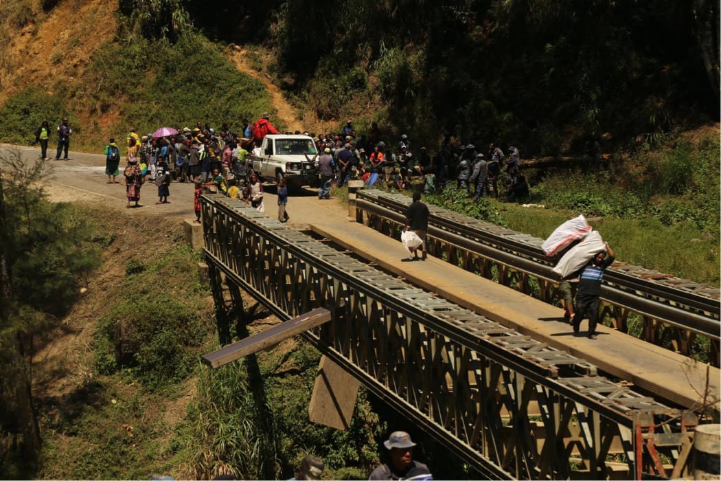 The travelling public is being forced to carry their belongings and cross by foot over one Kera Bridge.