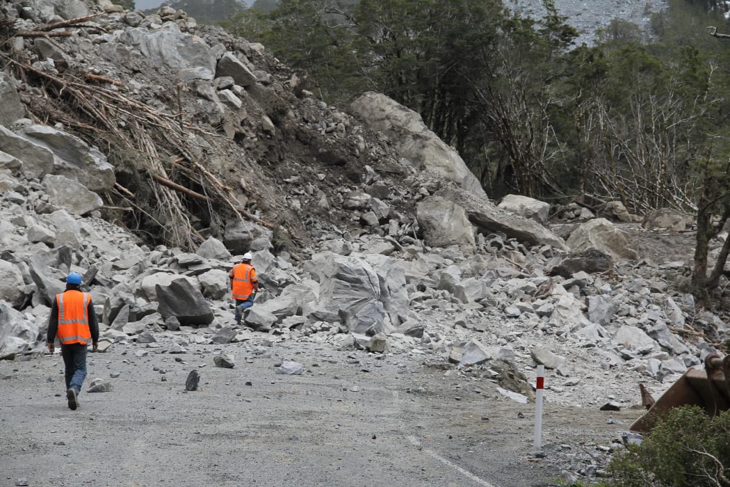 The scene on the Milford road after a giant boulder was blasted apart.