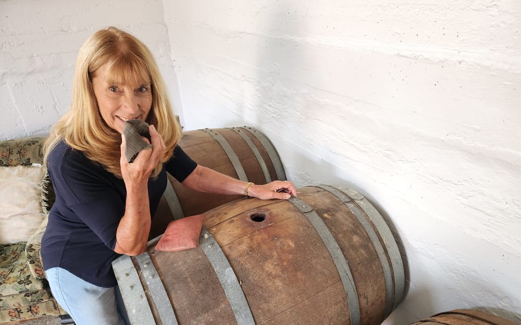 Lorenza used to help her father in the wine shed. The barrels still retain a pungent aroma