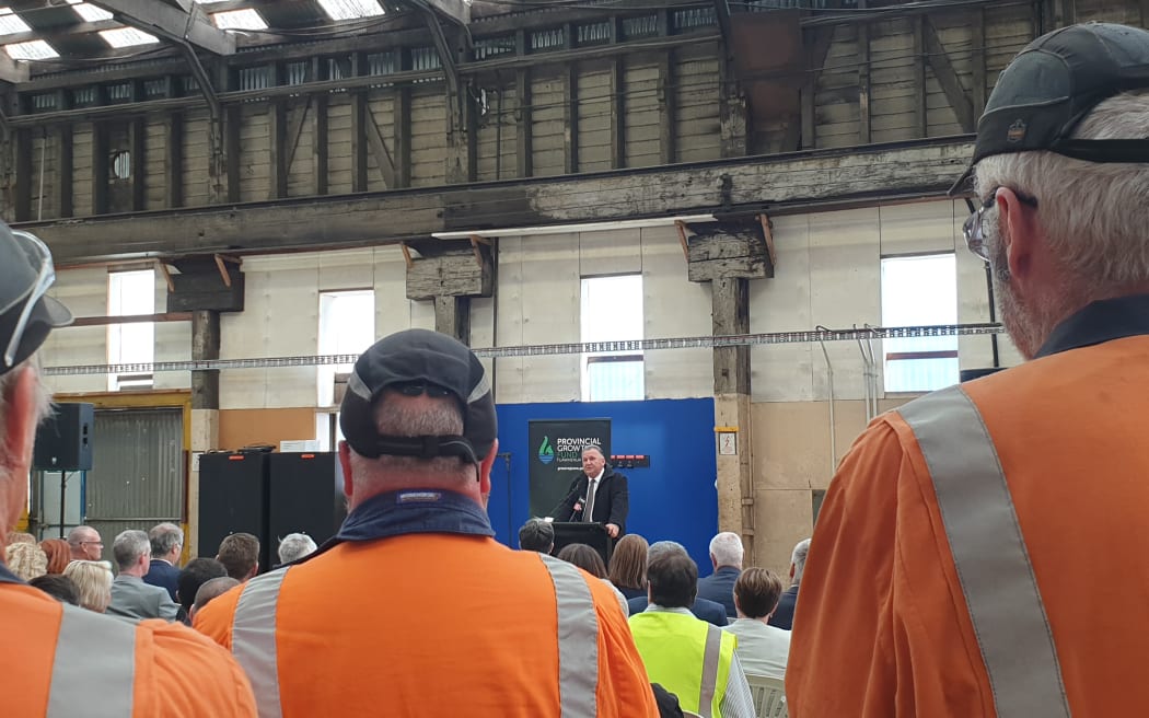 Workers listen as Regional Development Minister Shane Jones  announces nearly $$20m from the Provincial Growth Fund for upgrades.to Dunedin's Hillside workshop.
