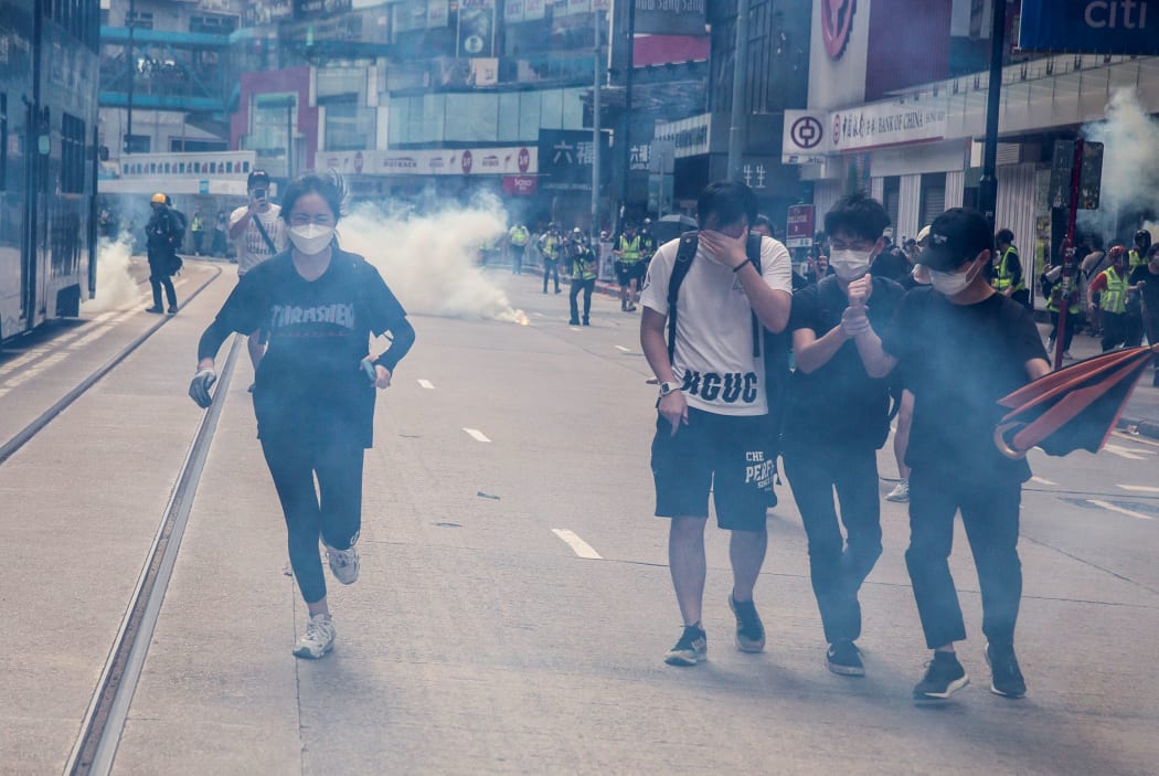 Police fire tear gas on protesters during a planned protests against a proposal to enact a new security legislation in Hong Kong on May 24, 2020.