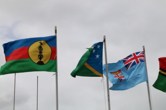 New Caledonia flag, left, flying at the 22nd Melanesian Spearhead Group leaders meeting in Port Vila.
