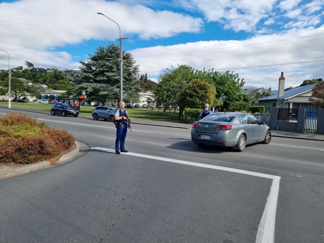 Armed police outside Bayfield High School, Dunedin, on 14 November 2023.