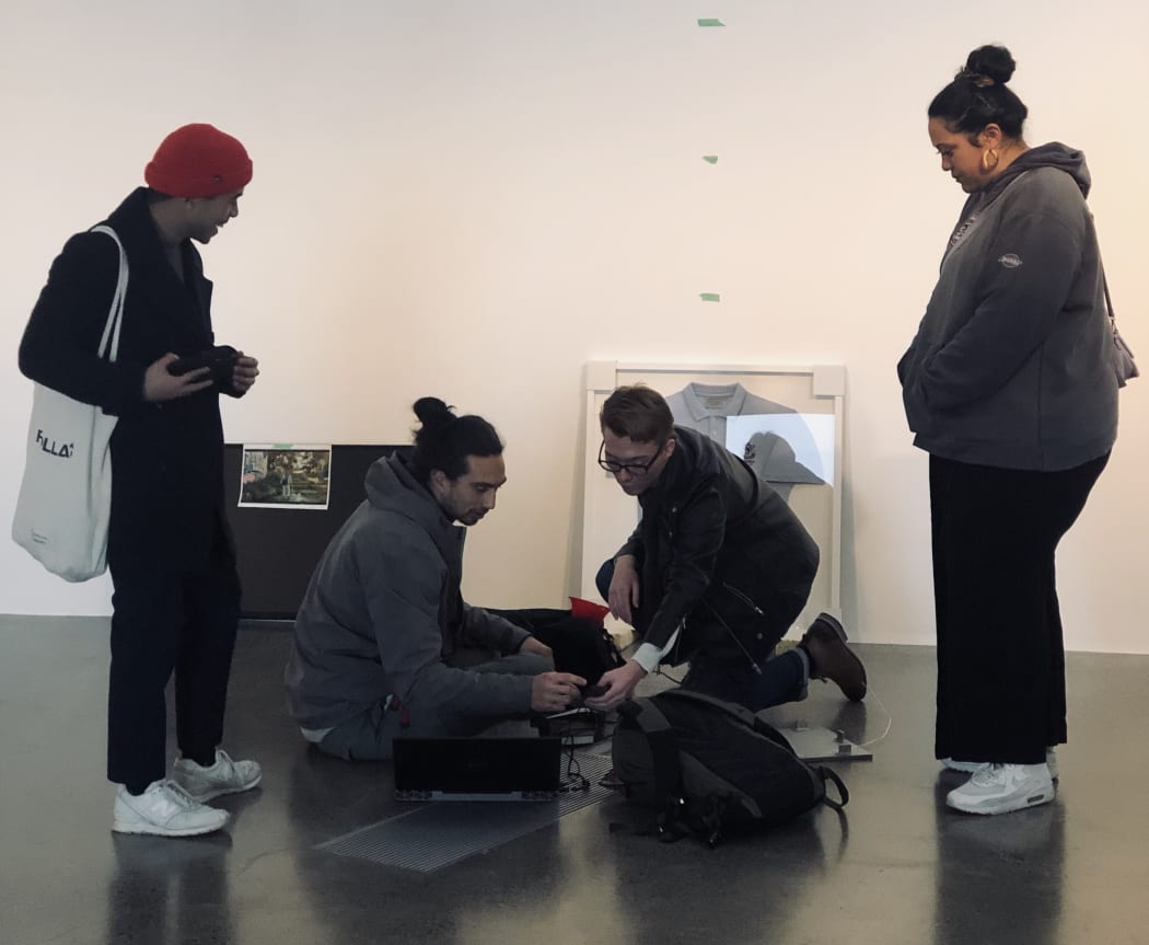 Members of Fresh One installing their new exhibition  WYF: Where You From?