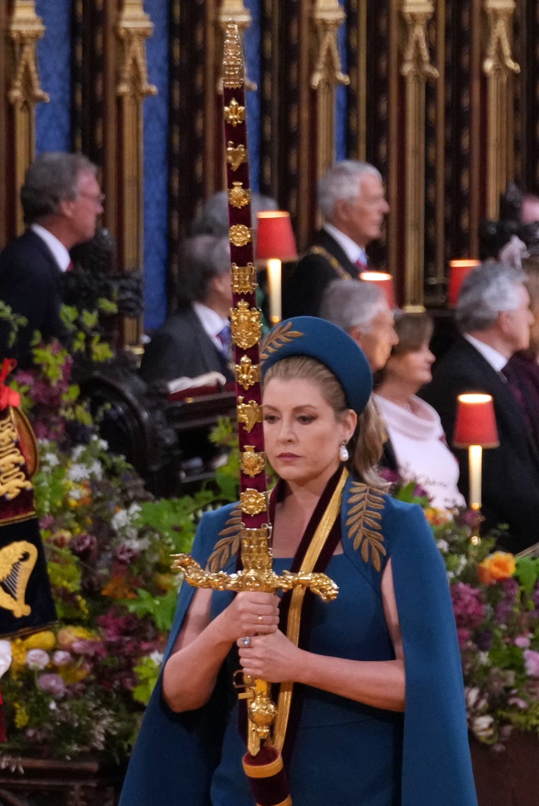 Lord President of the Council, Penny Mordaunt, carries the Sword of State ahead of the coronations of Britain's King Charles III and Britain's Camilla, Queen Consort at Westminster Abbey in central London on May 6, 2023. - The set-piece coronation is the first in Britain in 70 years, and only the second in history to be televised. Charles will be the 40th reigning monarch to be crowned at the central London church since King William I in 1066. Outside the UK, he is also king of 14 other Commonwealth countries, including Australia, Canada and New Zealand. Camilla, his second wife, will be crowned queen alongside him and be known as Queen Camilla after the ceremony. (Photo by Victoria Jones / POOL / AFP)