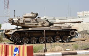 Saudi border guards stand guard in the closed al-Tuwal border crossing with Yemen in the southern Jizan province on October 3, 2017. In March 2015, a military coalition led by Saudi Arabia launched an air campaign against Shiite Huthi rebels and their allies in Yemen in support of President Abedrabbo Mansour Hadi. (Photo by Fayez Nureldine / AFP)