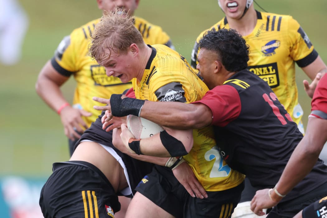 Hurricanes Ben Strang is tackled during the Super Rugby Aotearoa Under 20 Competition match between Chiefs Rugby Club Under 20's and Hurricanes Rugby Club Under 20's at Owen Delany Park on 11 April 2021 in Taupō, New Zealand.