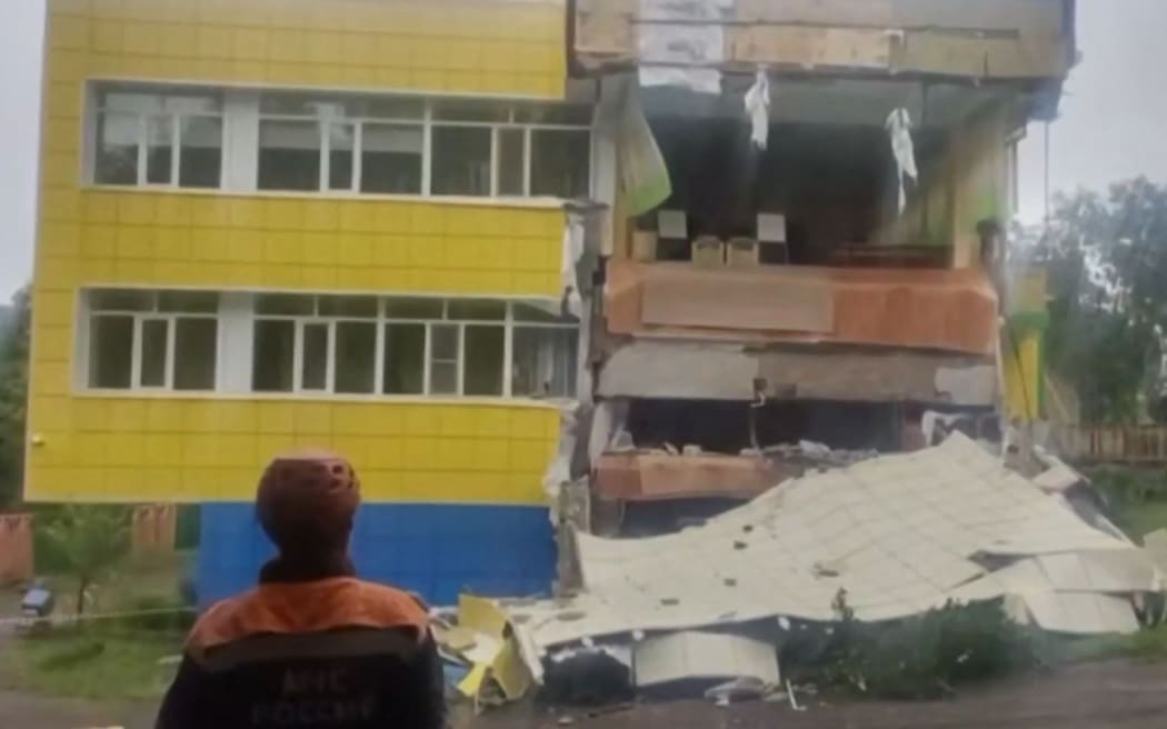 Rescuers inspect a damaged kindergarten building in Russia's Kamchatka region after the 8.8 magnitude earthquake struck off Russia's far east coast.