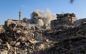 Smoke billows following an Israeli strike that targeted a building in the Bureij camp for Palestinian refugees in the central Gaza Strip on October 19, 2025.