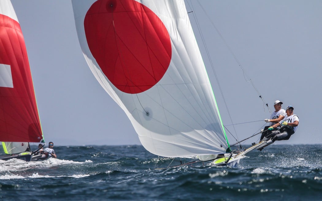 Leo Takahashi and Ibuki Koizumi competing for Japan in the 49er class at the Tokyo Olympics, 2021.