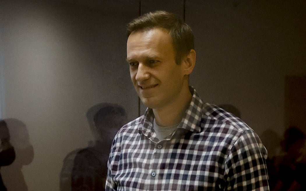MOSCOW, RUSSIA - FEBRUARY 20: Russian opposition Alexei Navalny stands inside a glass cell during a court hearing at the Babushkinsky district court in Moscow, Russia on February 20, 2021.