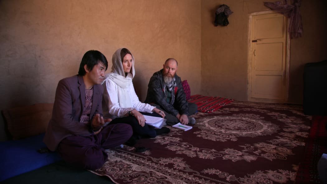 — Local translator Abdullah Shayagan, Paula Penfold, and Eugene Bingham interview three mothers about the loss of their children in the explosion of April 2014.